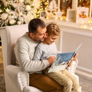 father and son talk enjoy noel eve, reading book