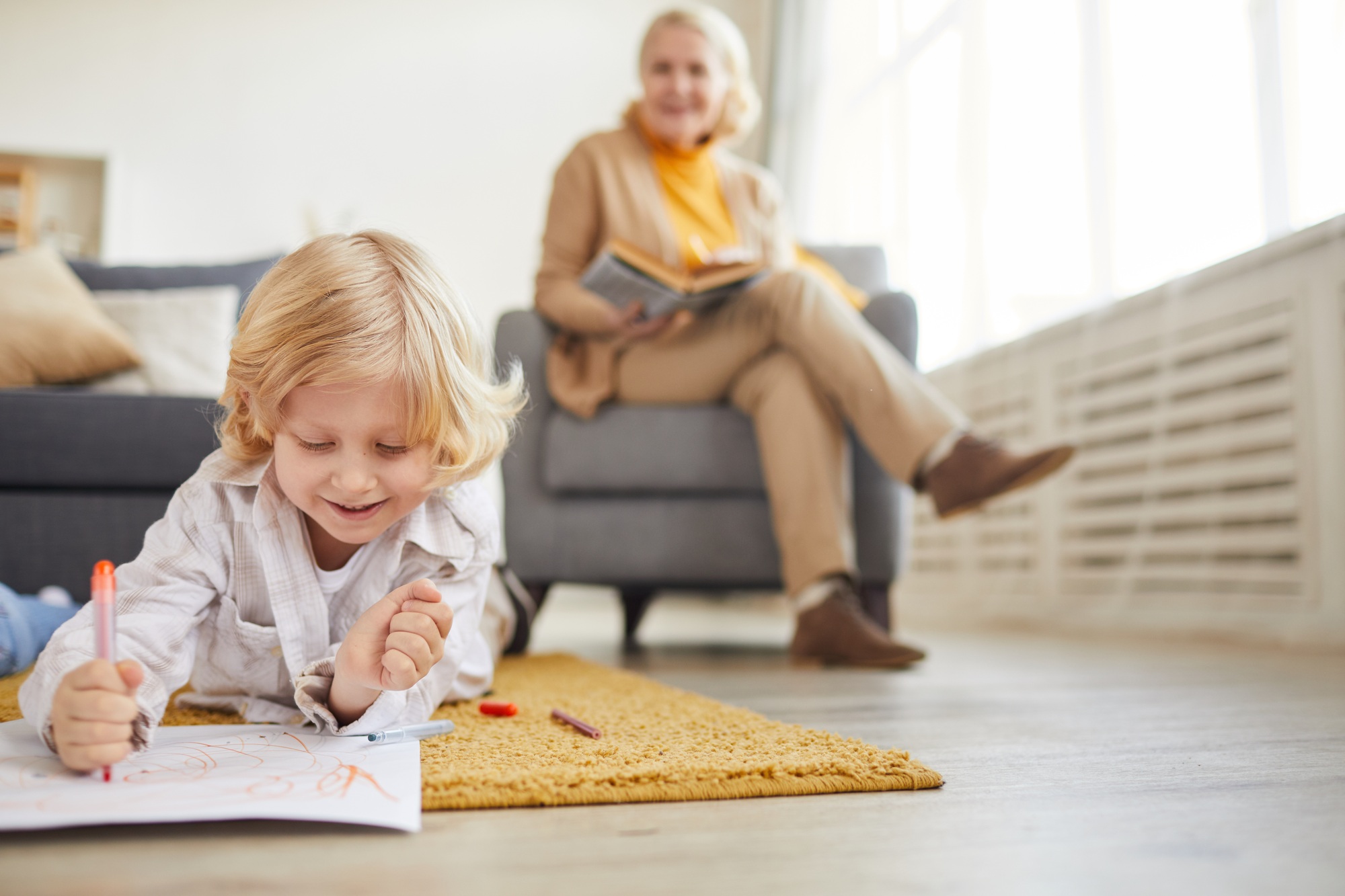 Little boy drawing on the floor